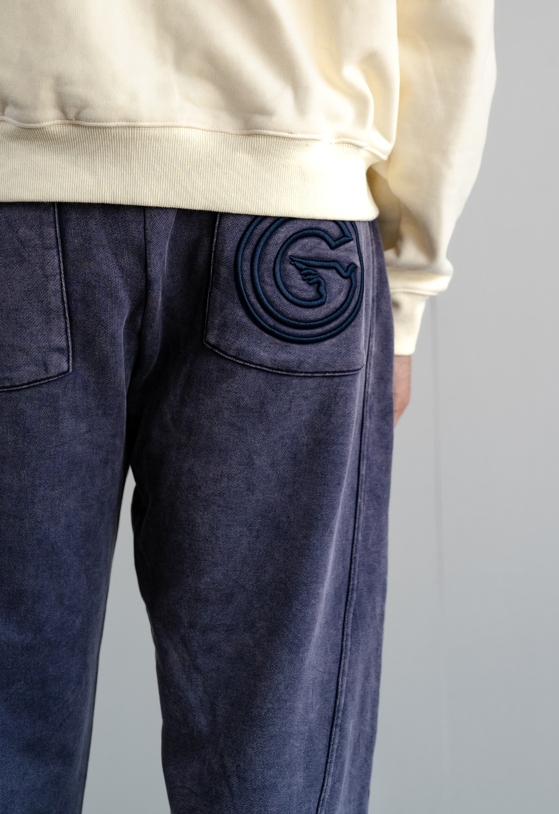 "LOGO" NAVY STUDDED SWEATPANTS